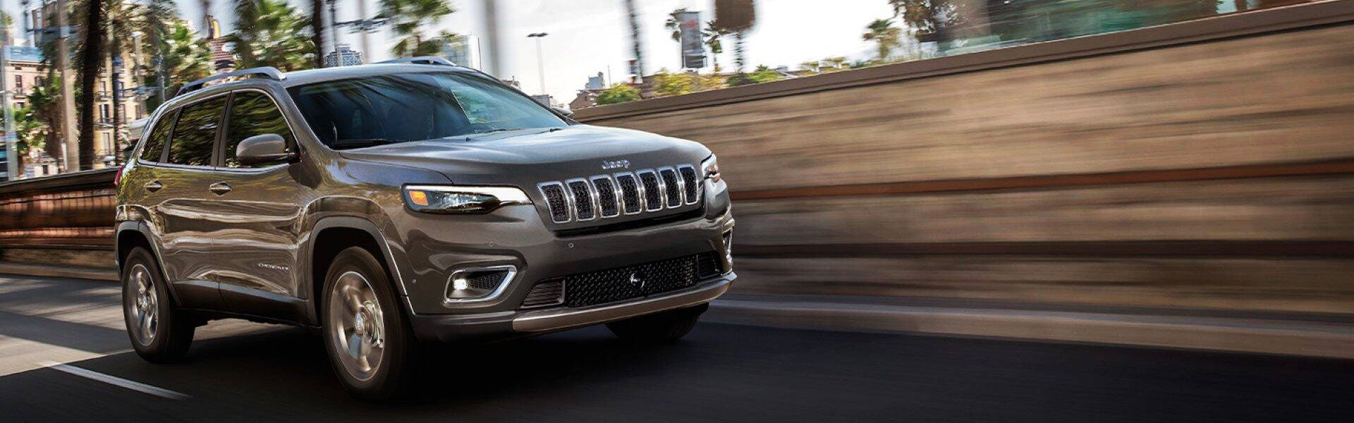 2021 Jeep Cherokee driving fast on road